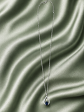 9ct White gold chain with white gold pear shaped diamond and sapphire pendant