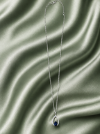 9ct White gold chain with white gold pear shaped diamond and sapphire pendant