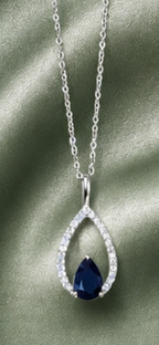 9ct White gold chain with white gold pear shaped diamond and sapphire pendant